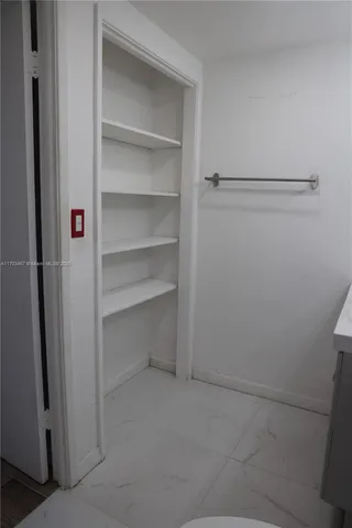 a view of an empty walk in closet
