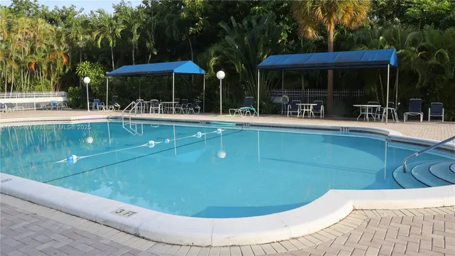 a view of a swimming pool with a patio