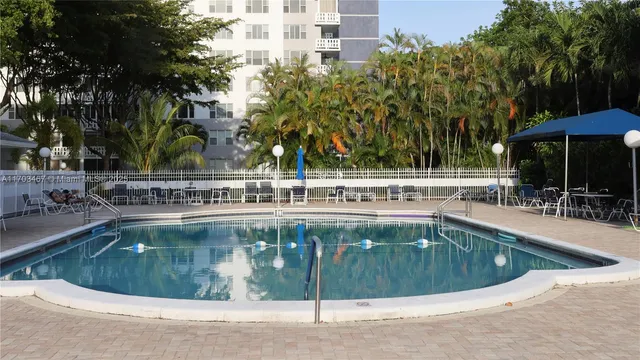 a view of a swimming pool with a patio