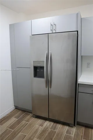 a view of a refrigerator in kitchen