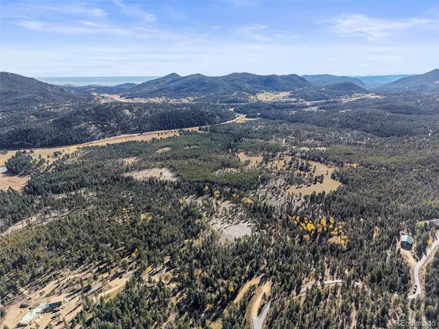 an aerial view of residential house and green space