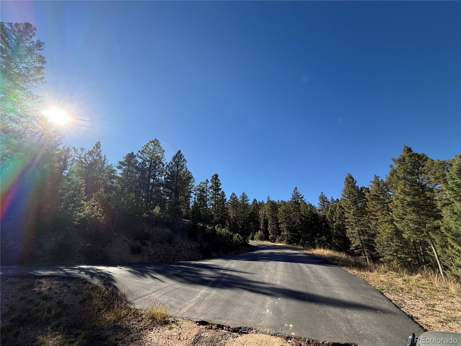 Parcel, Unit 4 Conifer, CO 80433 - Photo 10 of 23 a view of a street with sunset view