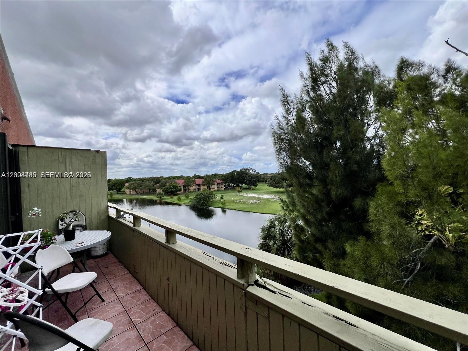 17530 Northwest 68th Avenue, Unit C4008 Hialeah, FL 33015 - Photo 11 of 26 a view of balcony with furniture