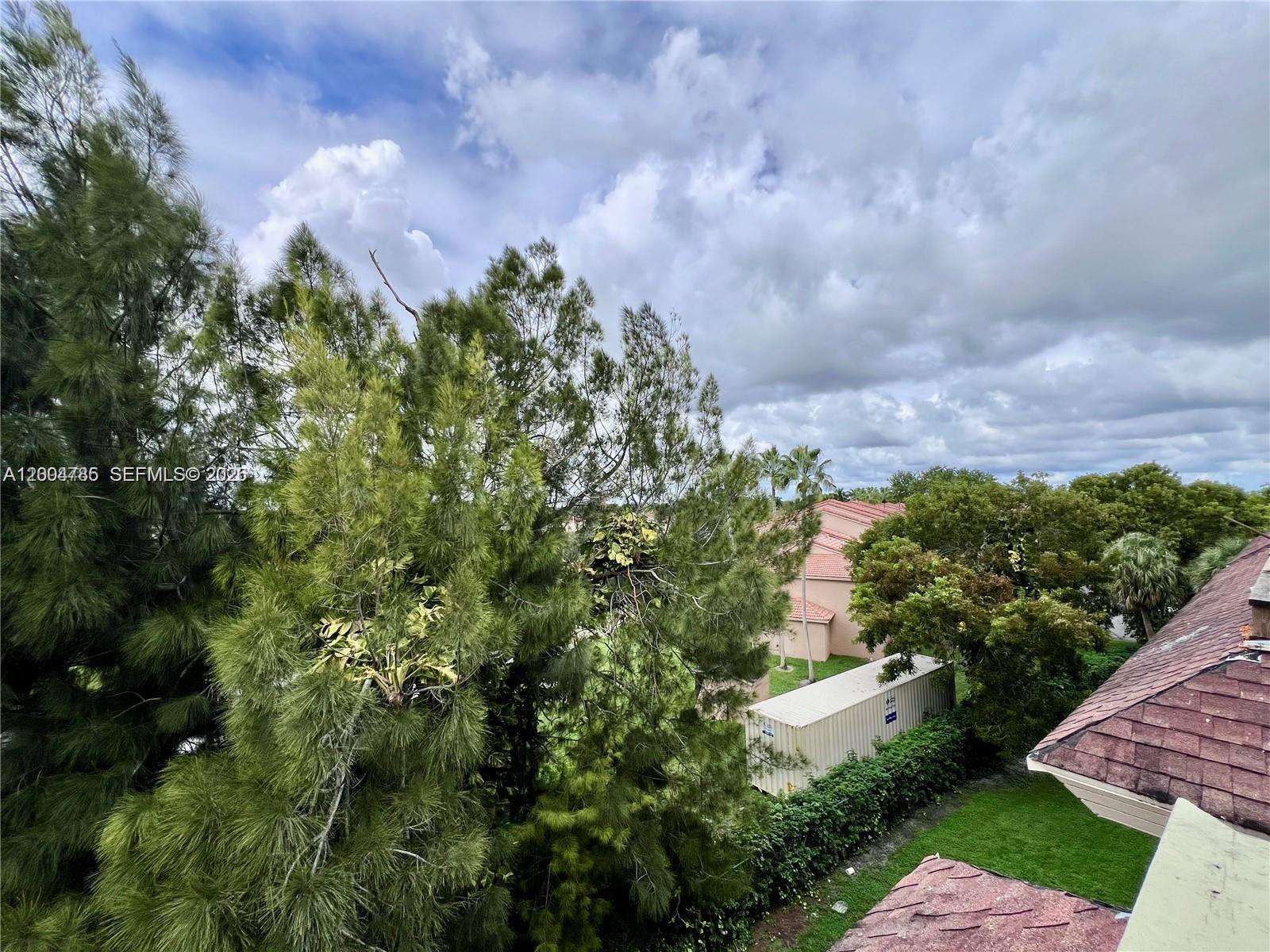 17530 Northwest 68th Avenue, Unit C4008 Hialeah, FL 33015 - Photo 12 of 26 a view of a bunch of trees
