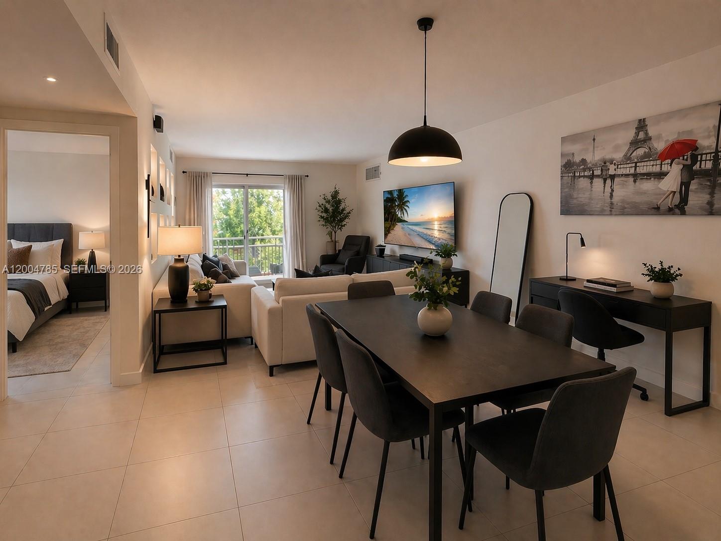 17530 Northwest 68th Avenue, Unit C4008 Hialeah, FL 33015 - Photo 2 of 26 a view of a dining room with furniture and a chandelier