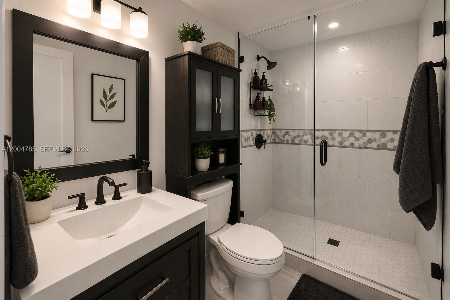 17530 Northwest 68th Avenue, Unit C4008 Hialeah, FL 33015 - Photo 5 of 26 a bathroom with a sink toilet and shower