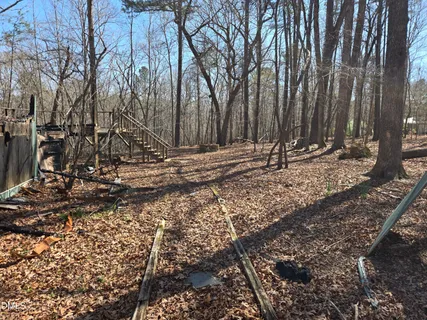 a view of a backyard of the house