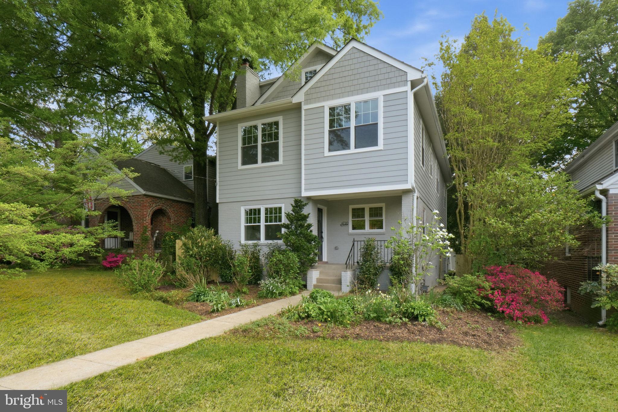 4720 Ellicott Street Northwest Washington, DC 20016 - Photo 2 of 52 a front view of a house with garden