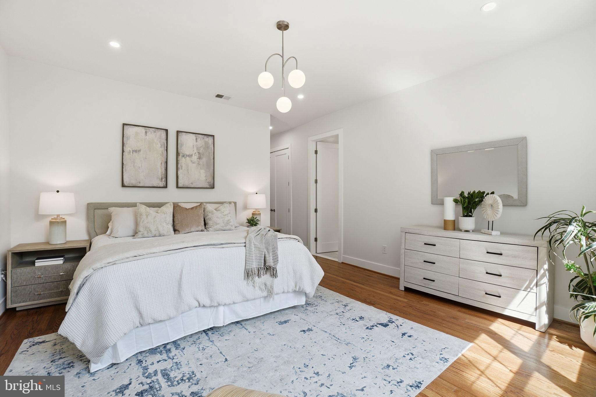 4720 Ellicott Street Northwest Washington, DC 20016 - Photo 22 of 52 a large white bed in a white room