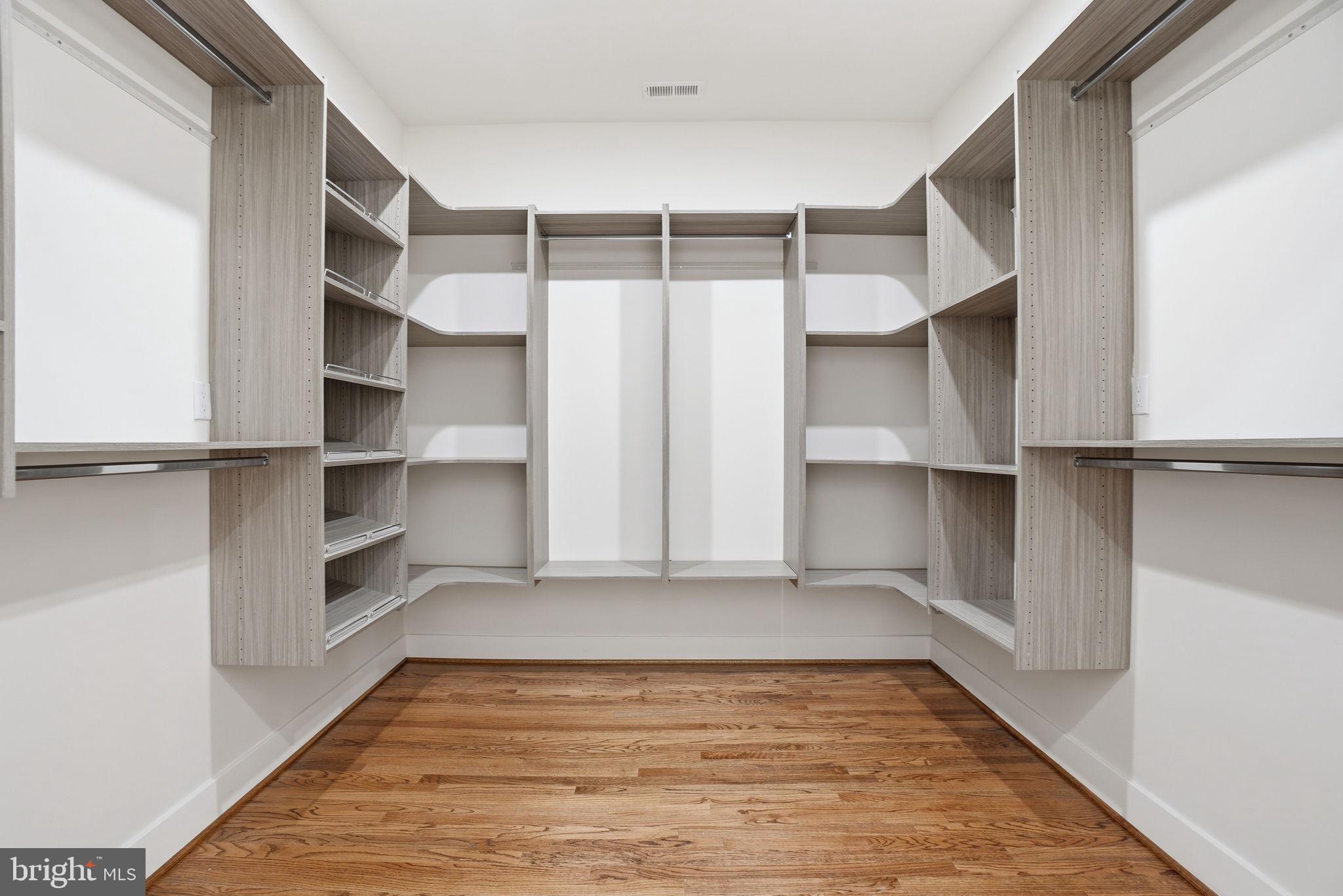 4720 Ellicott Street Northwest Washington, DC 20016 - Photo 23 of 52 a view of walk in closet with empty racks