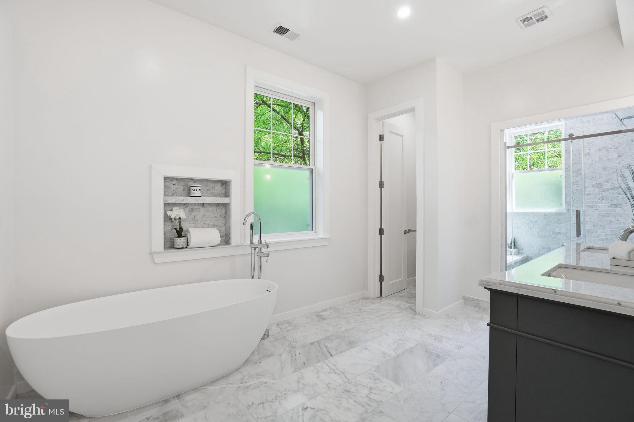 4720 Ellicott Street Northwest Washington, DC 20016 - Photo 24 of 52 a bathroom with a bathtub and a sink