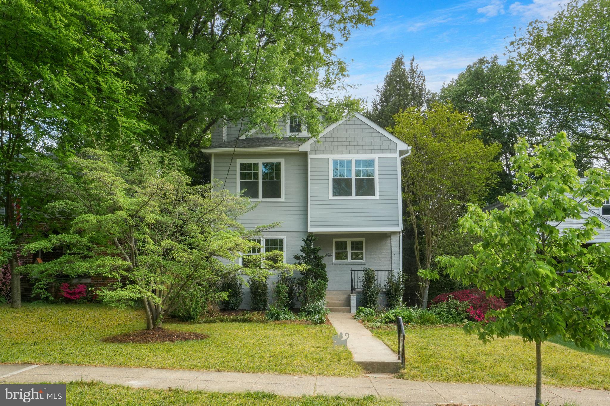 4720 Ellicott Street Northwest Washington, DC 20016 - Photo 4 of 52 a front view of a house with a yard