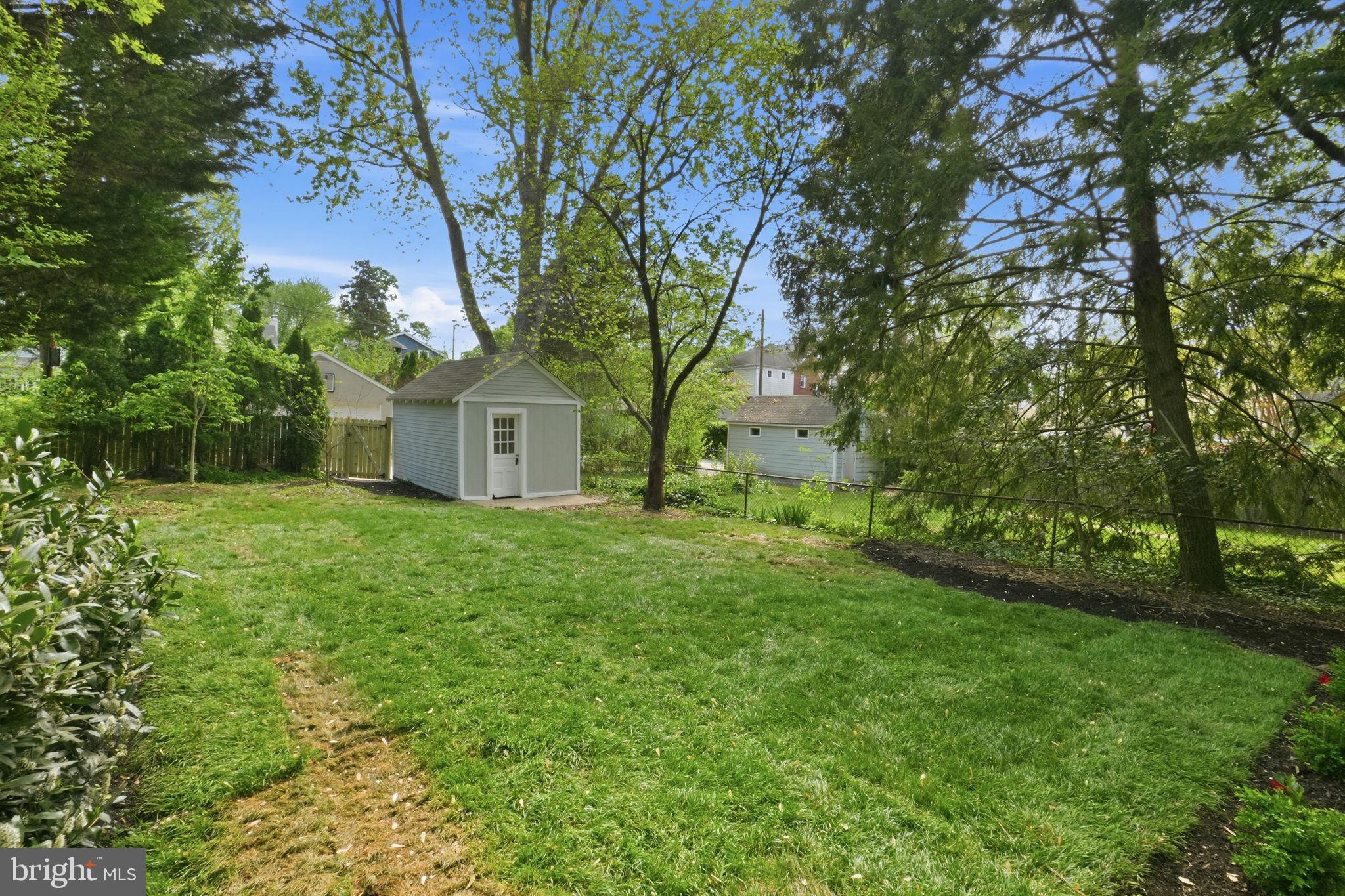 4720 Ellicott Street Northwest Washington, DC 20016 - Photo 48 of 52 a view of a house with backyard and garden