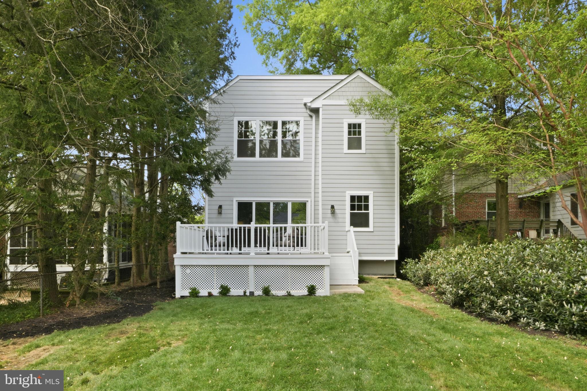 4720 Ellicott Street Northwest Washington, DC 20016 - Photo 50 of 52 front view of a house with a yard