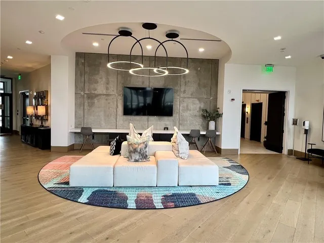 a view of a living room and a chandelier