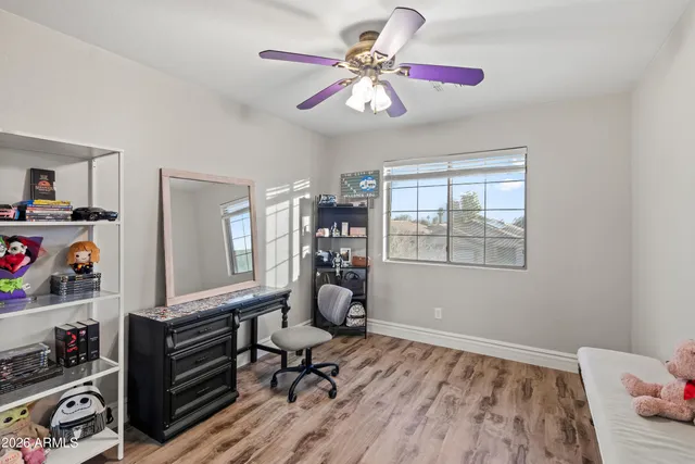 a bedroom with furniture and a window