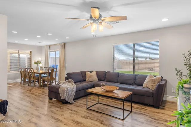 a living room with furniture and a large window