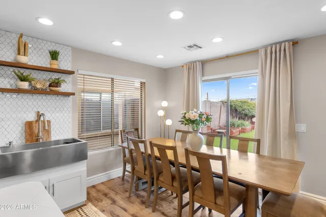a view of a dining room with furniture window and outside view