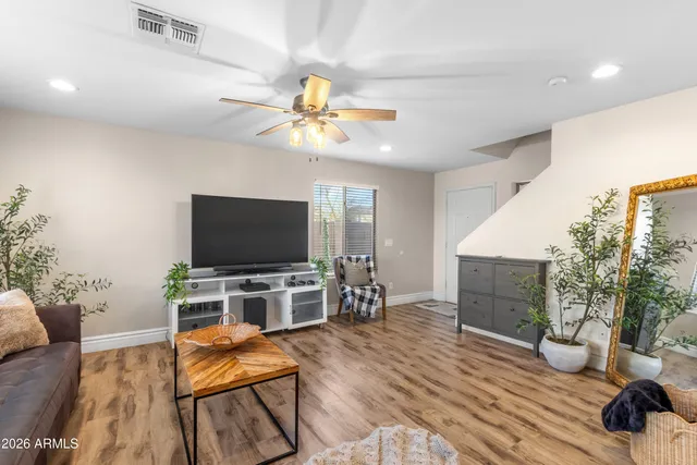 a view of a livingroom with furniture and a flat screen tv