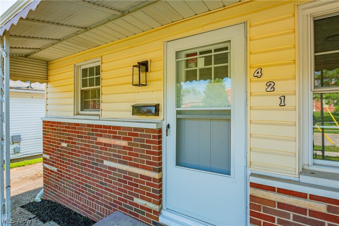 421 Hillman Road Akron, OH 44312 - Photo 3 of 27 View of exterior entry with covered porch