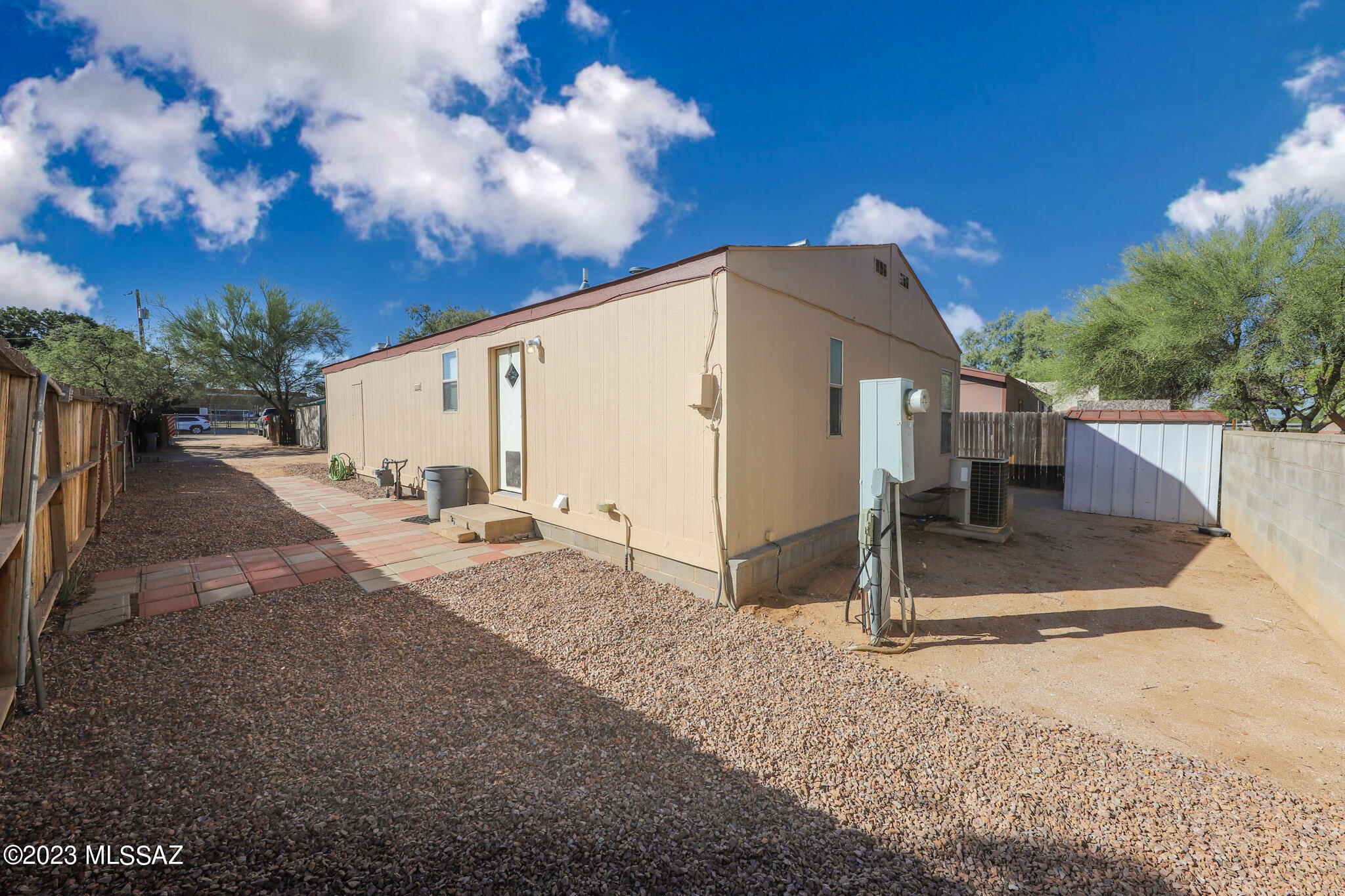55 East King Road Tucson, AZ 85705 - Photo 9 of 26 a view of a white house with a yard