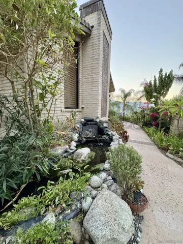 a kitchen with kitchen island granite countertop a sink stove and refrigerator