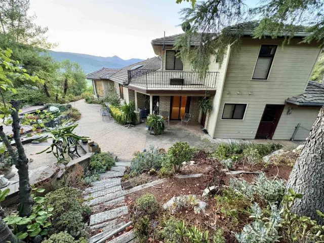 a living room with a flat screen tv and a fireplace