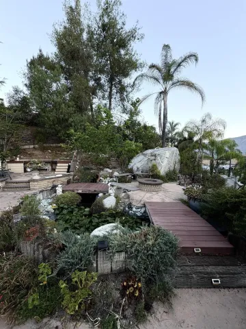 a bathroom with a sink a toilet a shower and a mirror