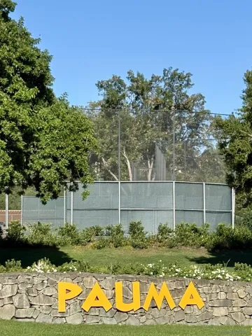 a view of a backyard with sitting area