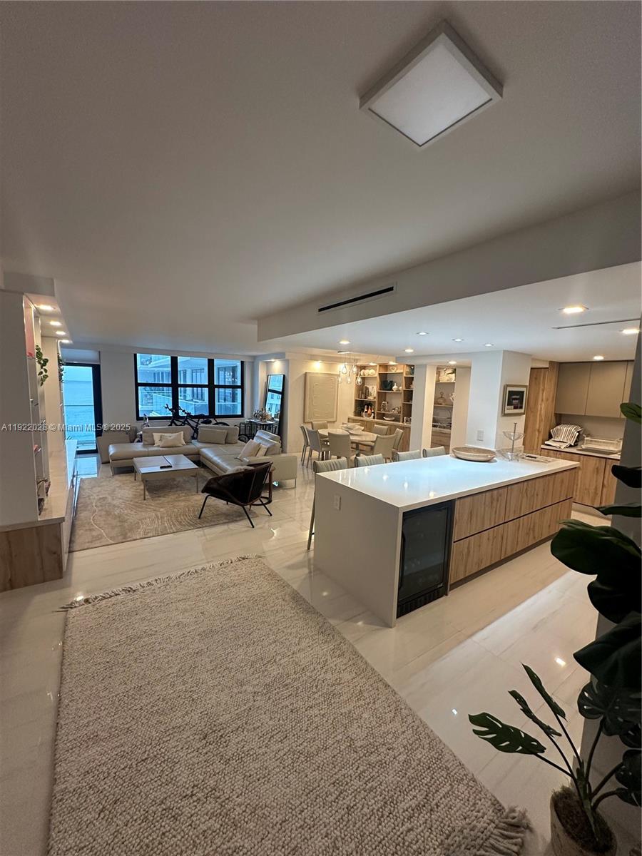 9801 Collins Avenue, Unit 19P Bal Harbour, FL 33154 - Photo 2 of 10 a living room with furniture and a wooden floor