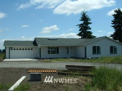 16942 Sheldon Lane Southwest Rochester, WA 98579 - Photo 1 of 1 a view of a house with a yard