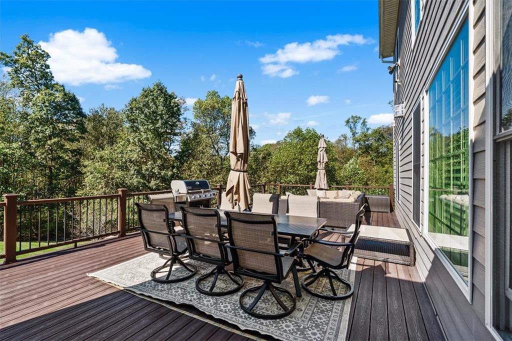 204 Durrow Court Mars, PA 16046 - Photo 14 of 24 a view of a roof deck with table and chairs with wooden floor and fence