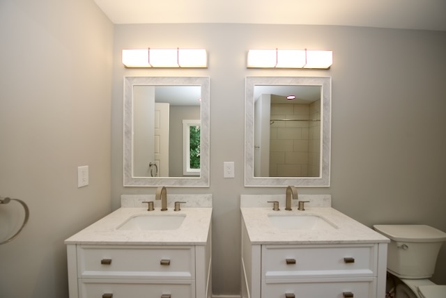 317 Pendleton Road Clemson, SC 29631 - Photo 28 of 36 Dual vanities with pristine white countertops elevate this spacious bathroom.