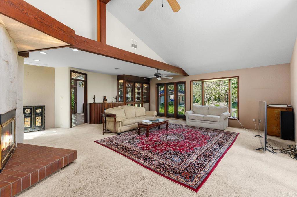 29560 Lilac Road Valley Center, CA 92082 - Photo 41 of 43 a living room with rug floor to ceiling window and a rug