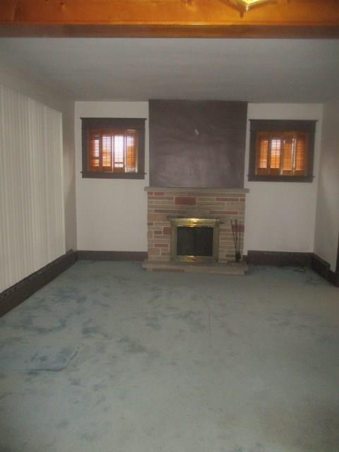 560 5th Street Butler, PA 16001 - Photo 2 of 20 Large Living Room has stone log burning Fireplace and windows on each side.