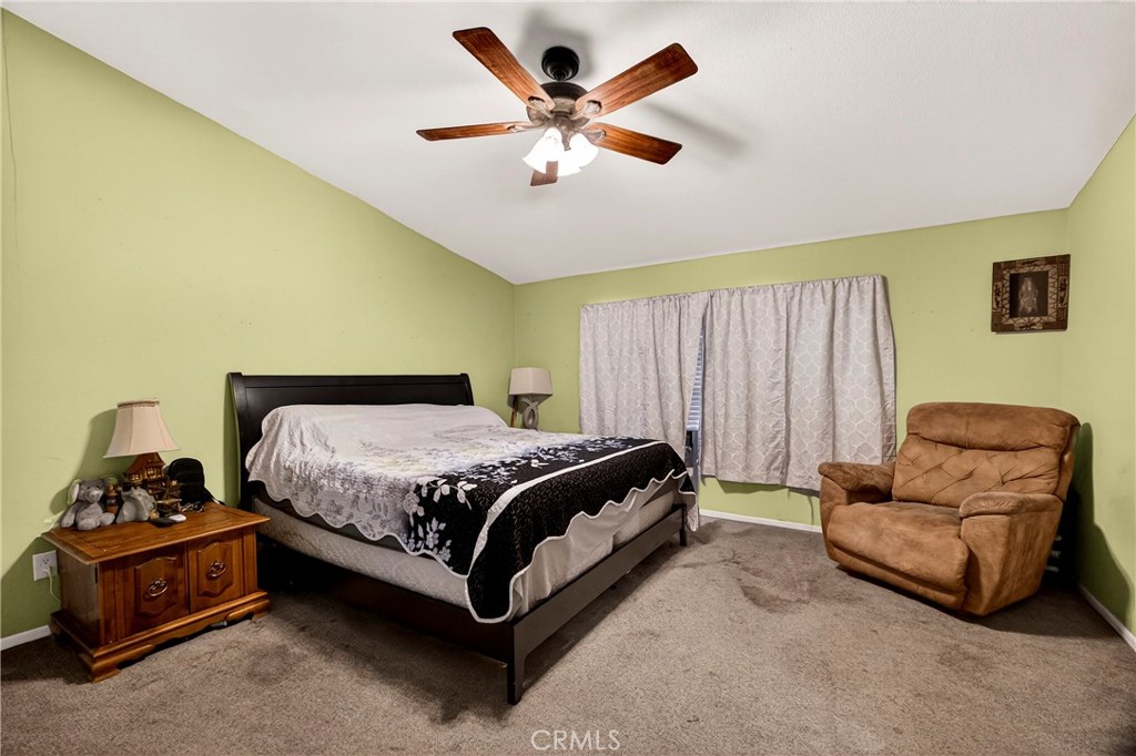 32 Sheldon Avenue Gridley, CA 95948 - Photo 28 of 75 a spacious bedroom with a bed and a couch