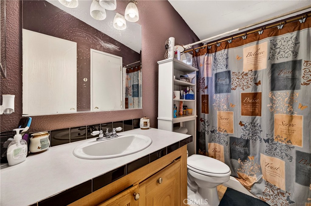 32 Sheldon Avenue Gridley, CA 95948 - Photo 38 of 75 a bathroom with a sink toilet vanity and shower