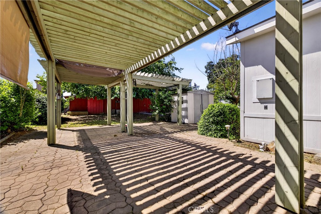 32 Sheldon Avenue Gridley, CA 95948 - Photo 52 of 75 a view of a patio with table and chairs potted plants and large tree