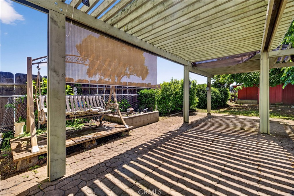 32 Sheldon Avenue Gridley, CA 95948 - Photo 55 of 75 a view of a patio with a table chairs and wooden fence