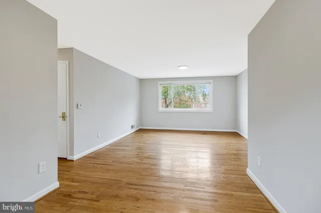 a kitchen with stainless steel appliances white cabinets and a stove