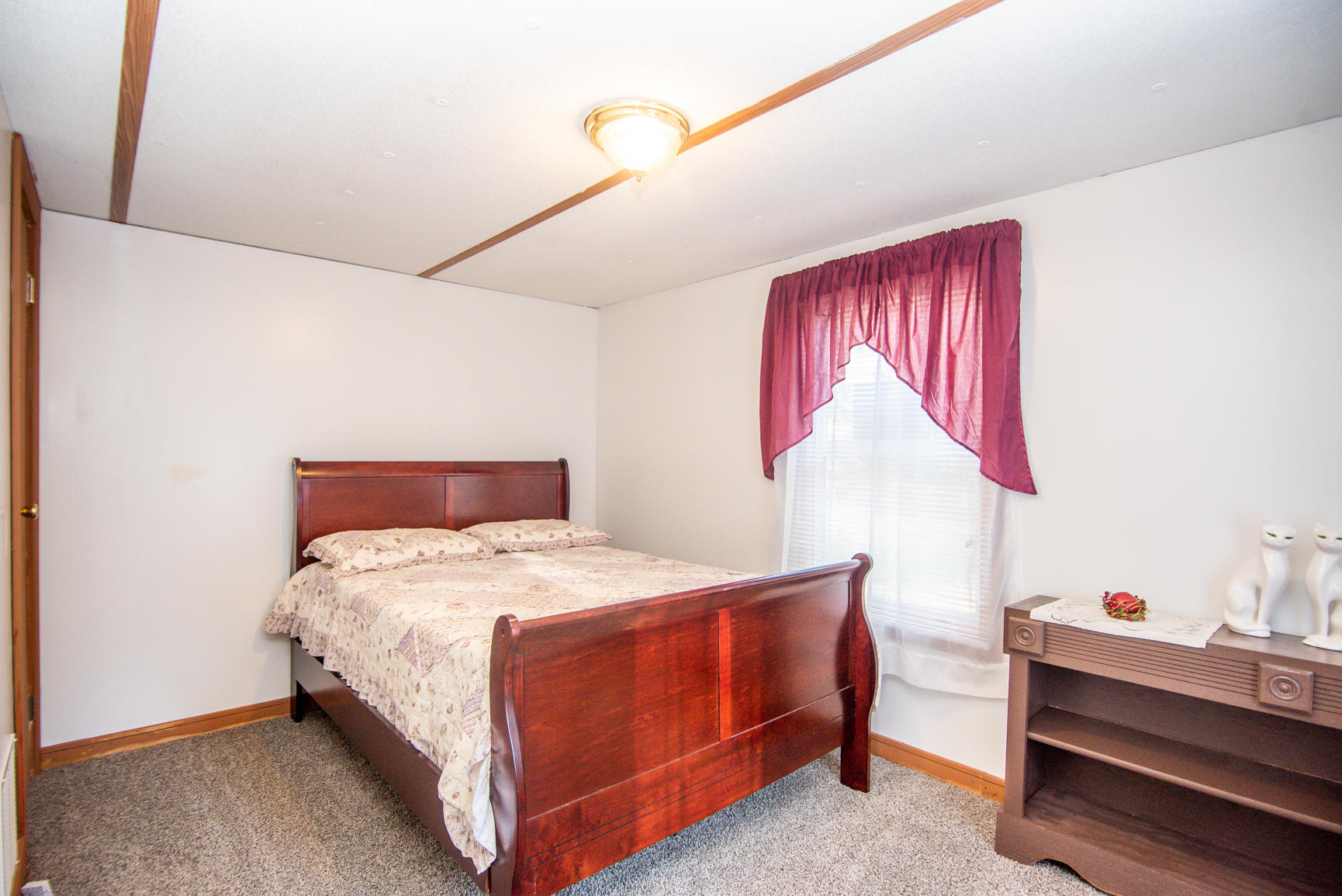 143 Sunset Ridge Road Callaway, VA 24067 - Photo 17 of 42 a bedroom with a bed and a dresser