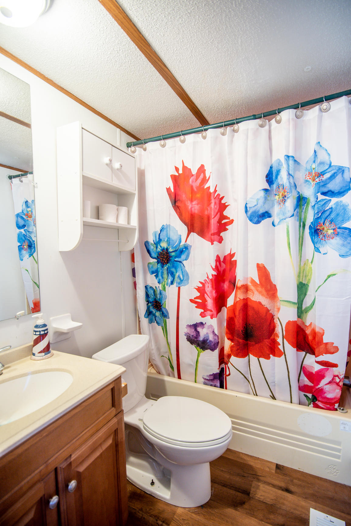 143 Sunset Ridge Road Callaway, VA 24067 - Photo 19 of 42 a bathroom with a sink mirror and toilet