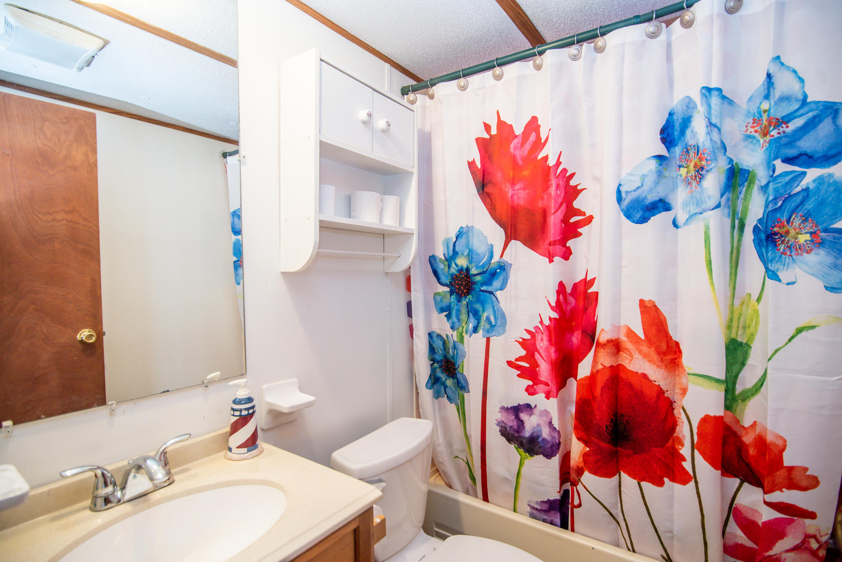 143 Sunset Ridge Road Callaway, VA 24067 - Photo 20 of 42 a bathroom with a sink mirror and vanity
