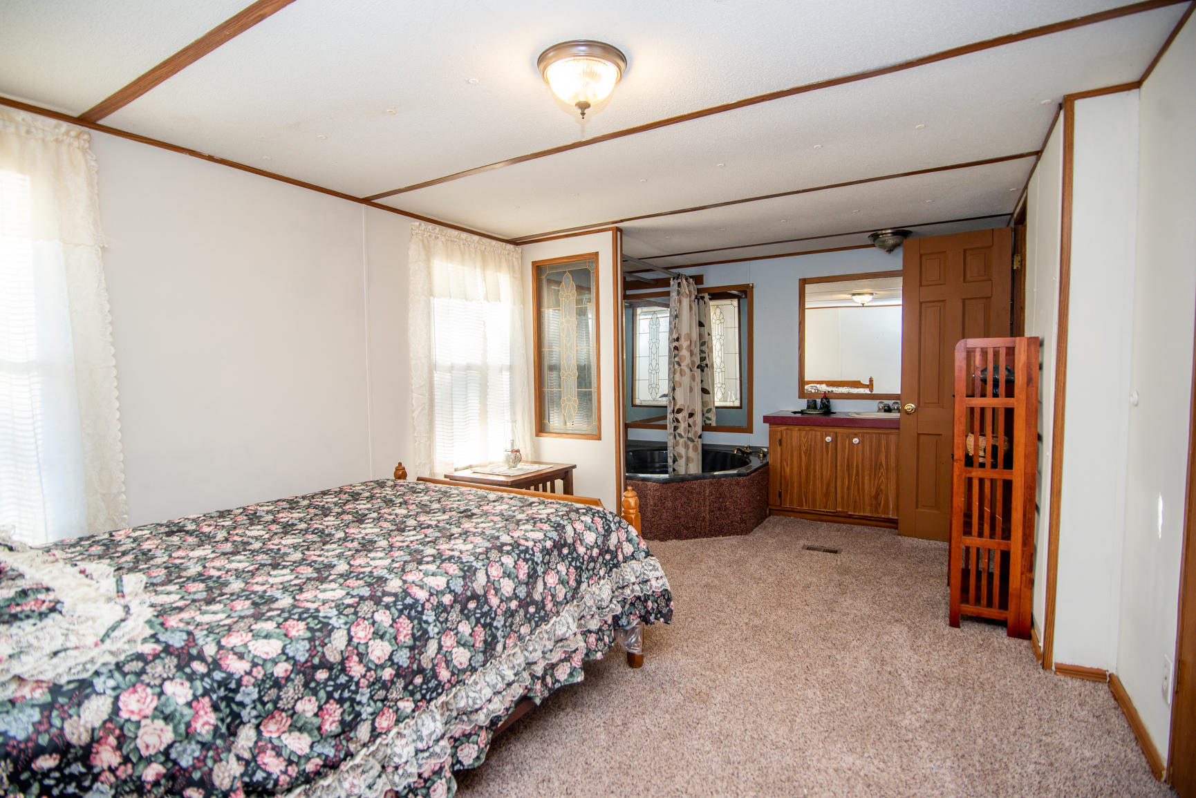 143 Sunset Ridge Road Callaway, VA 24067 - Photo 35 of 42 a bedroom with a large bed and furniture