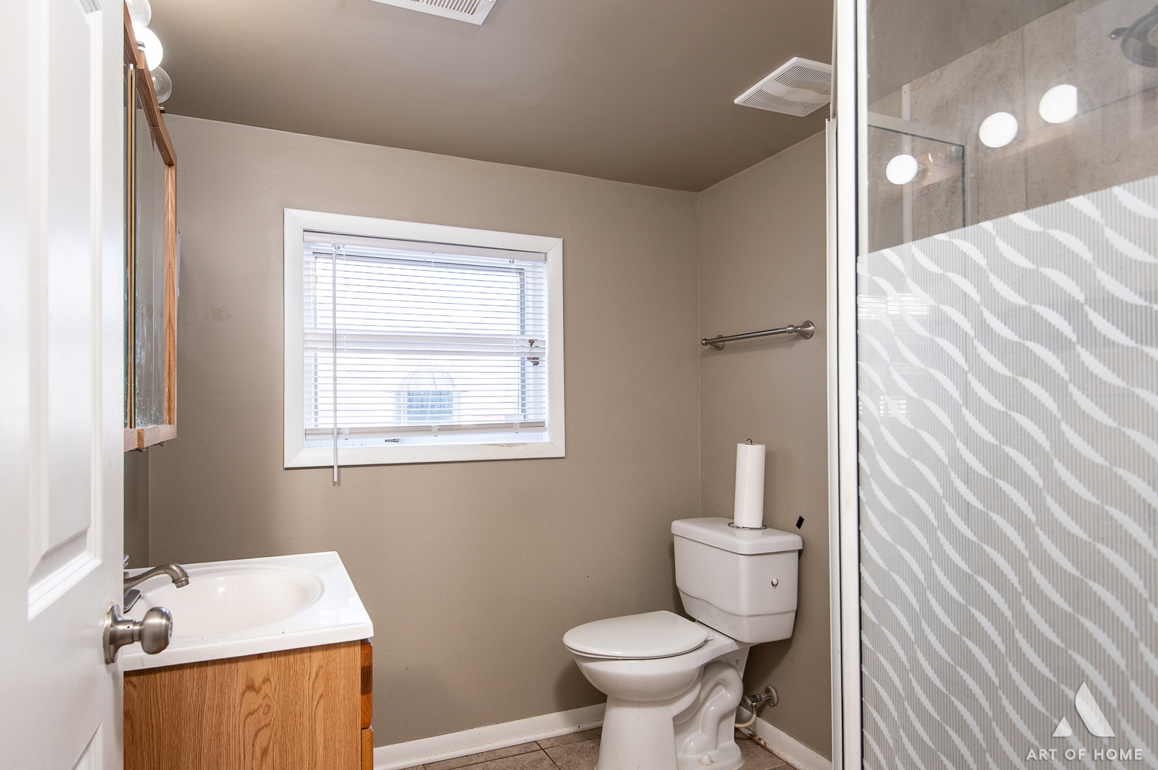 3034 190th Street Lansing, IL 60438 - Photo 12 of 25 a bathroom with a toilet sink and mirror