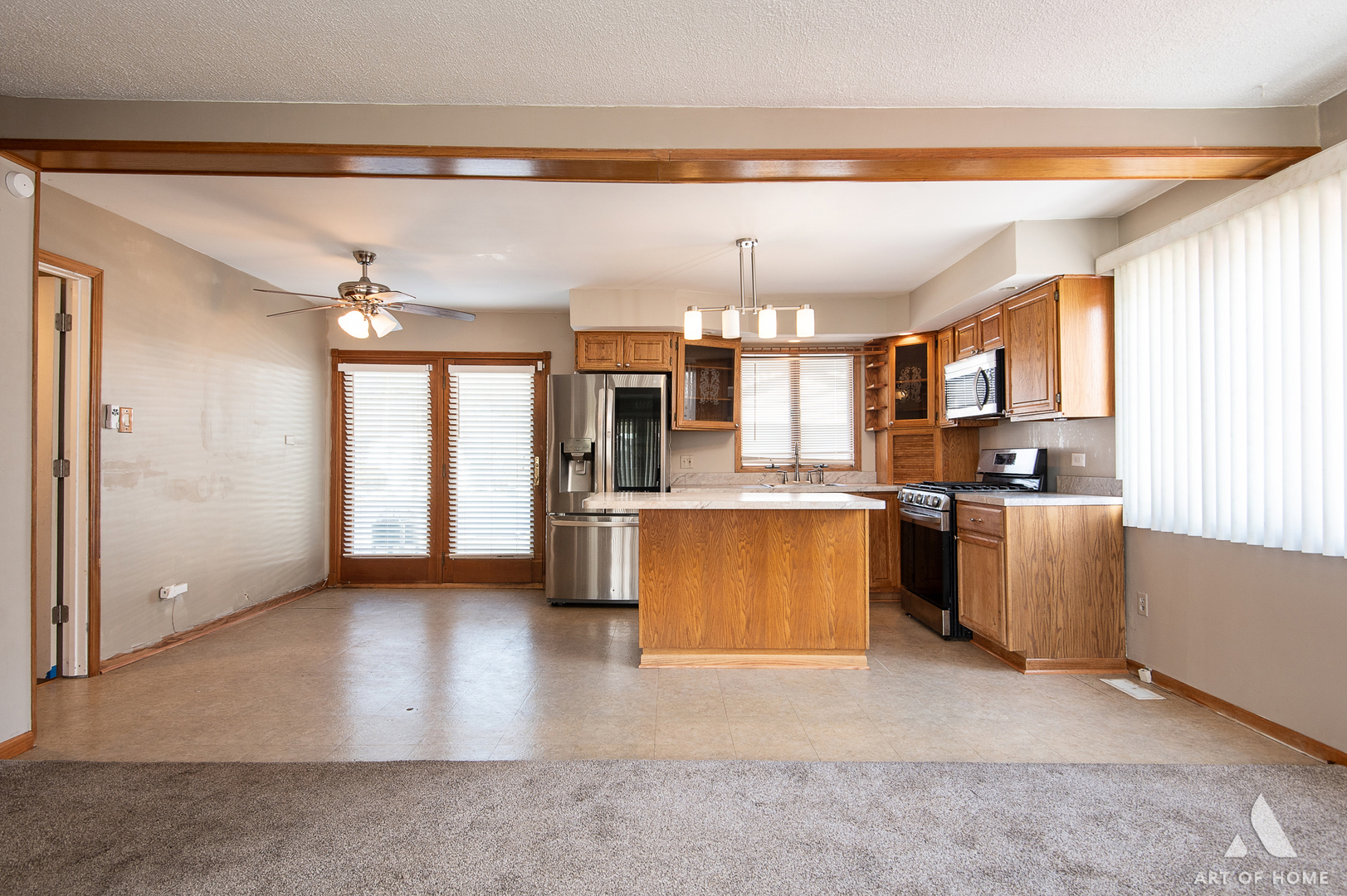 3034 190th Street Lansing, IL 60438 - Photo 3 of 25 a view of a kitchen with furniture and stainless steel appliances