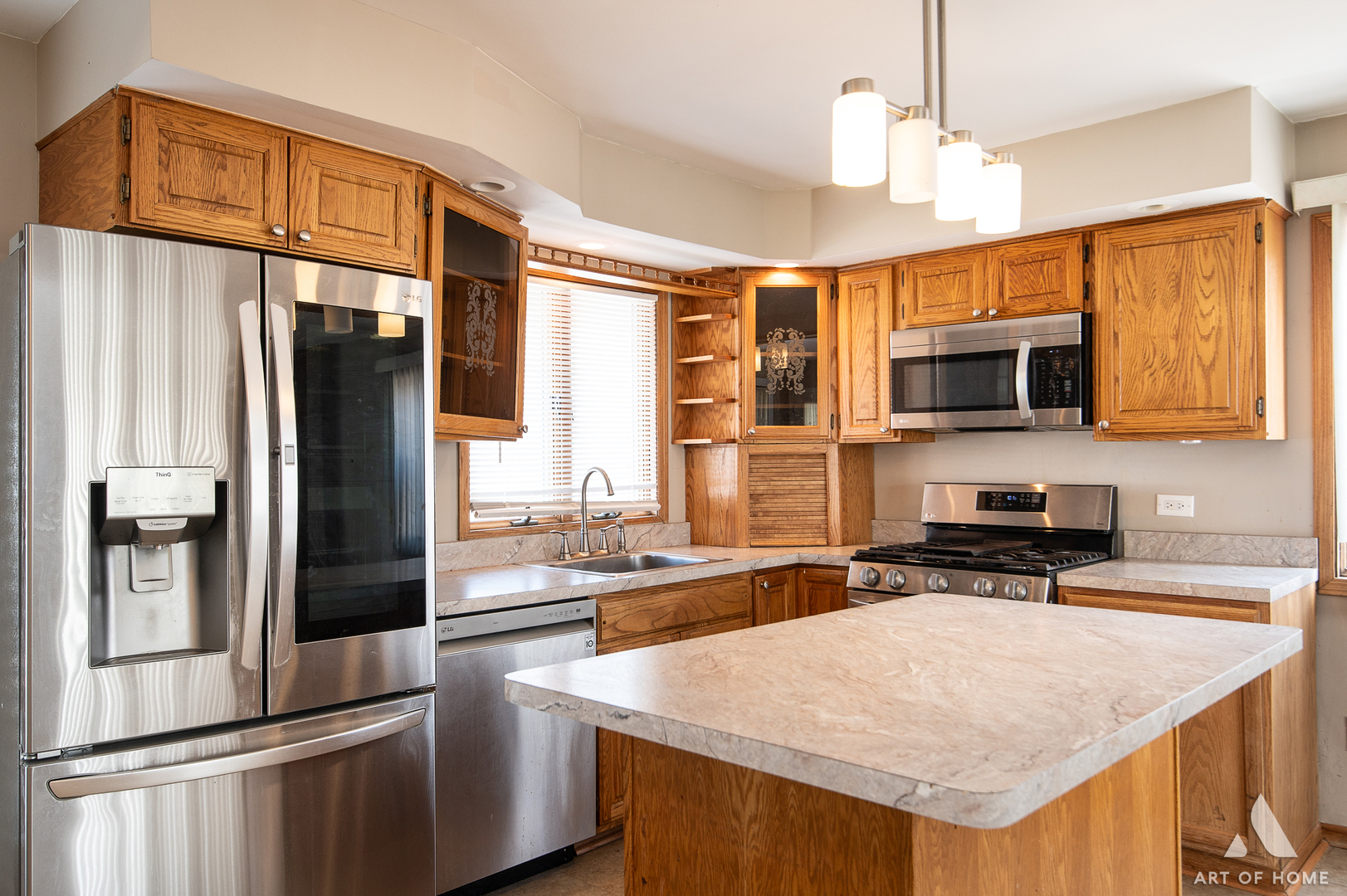 3034 190th Street Lansing, IL 60438 - Photo 4 of 25 a kitchen with stainless steel appliances granite countertop a refrigerator a stove and a sink with wooden floor