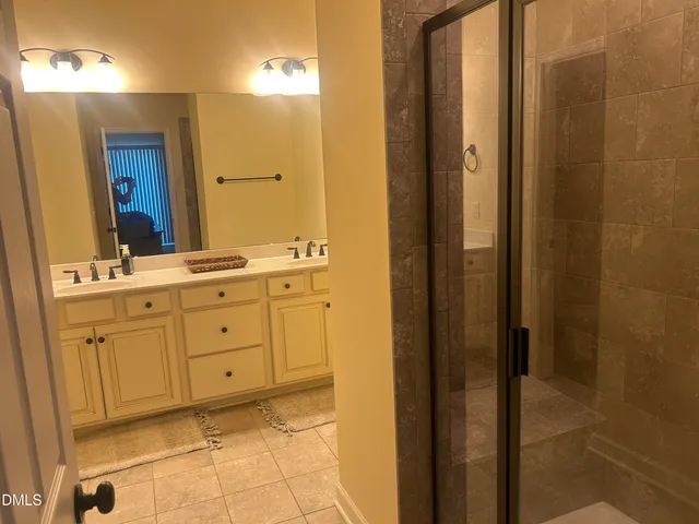 a white toilet sitting next to a shower curtain