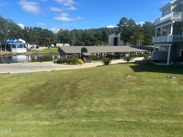 a view of a lake with a house in the background