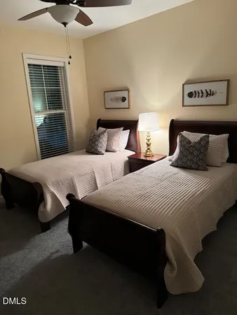 a bedroom with double bed and a window